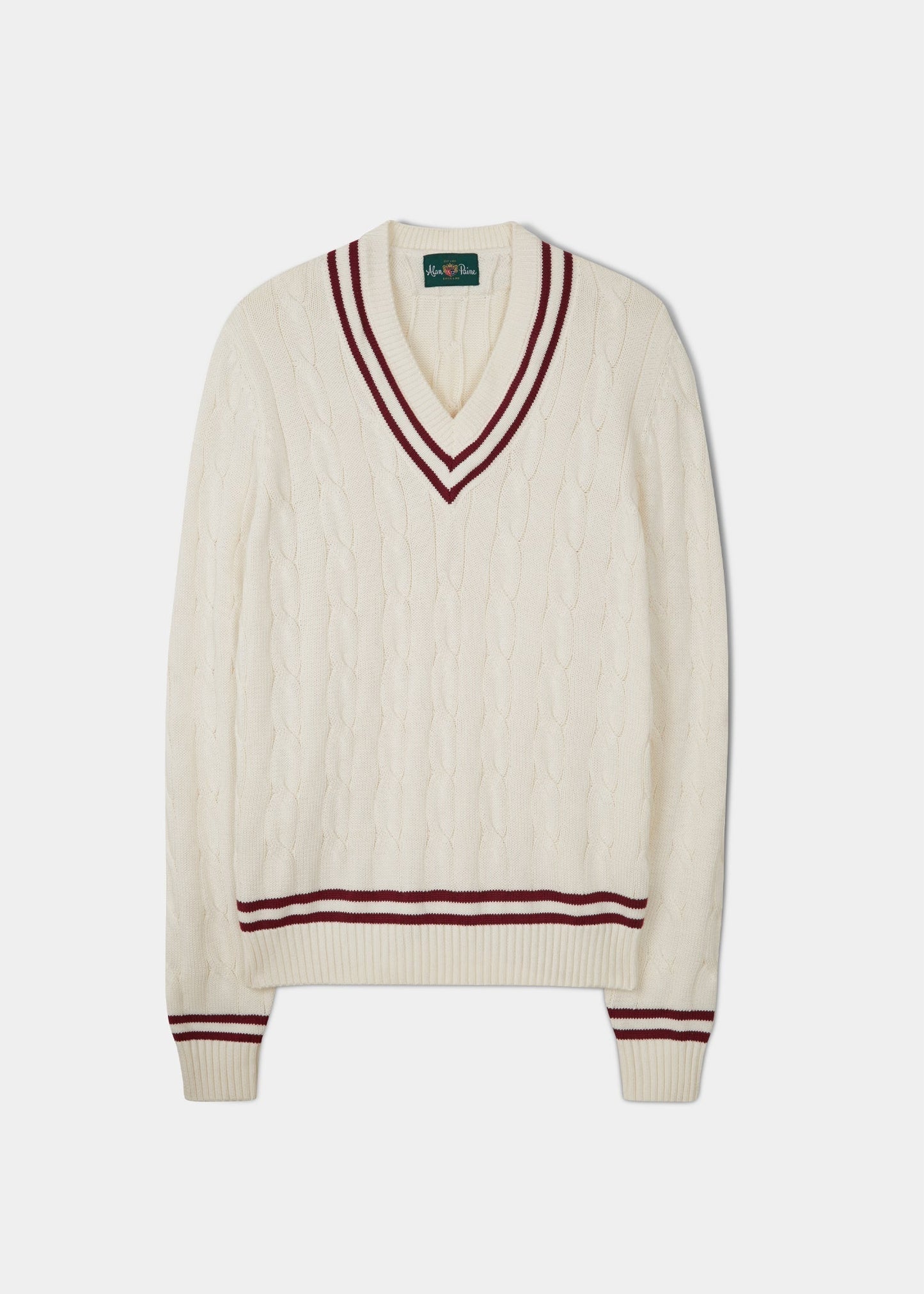 Ecru cricket jumper with a claret red trim and cable knit design.