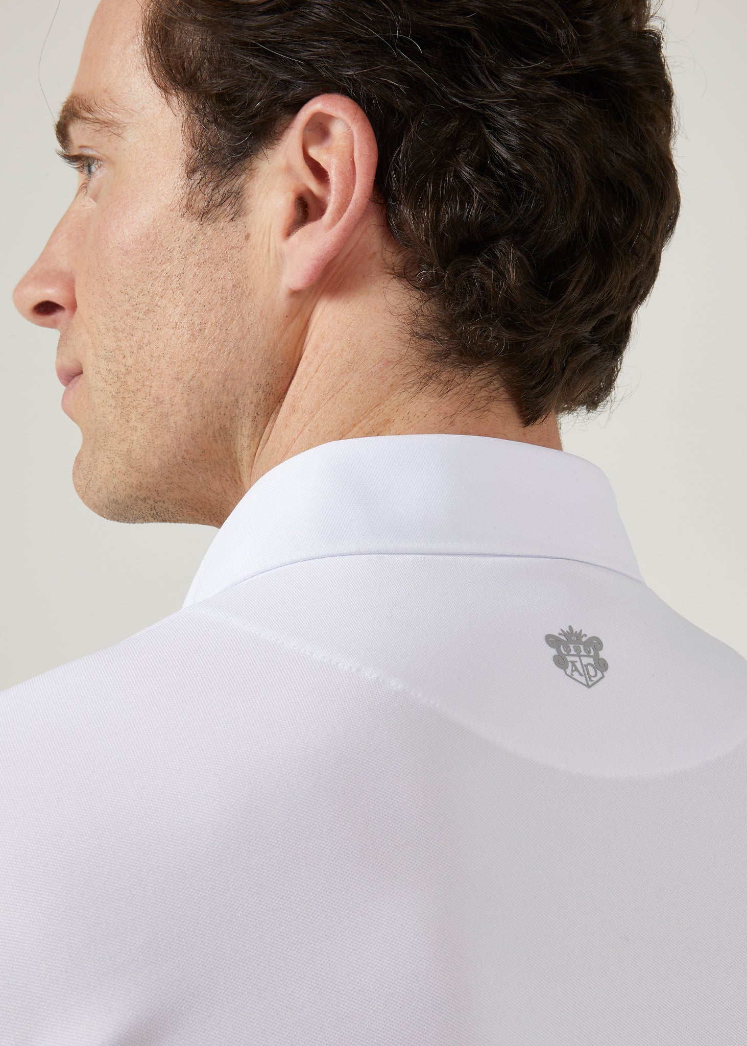 Men's 3 button polo shirt in white.